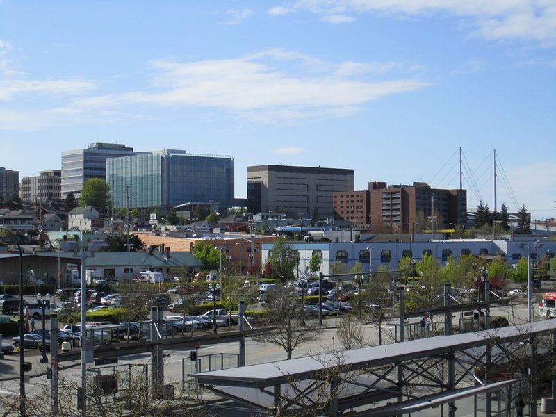 Downtown Everett from the station — the reference photograph the skyline silhouette was traced from, showing the mid-rise office blocks, the brick hotel, and the cable-stayed masts at the transit center
